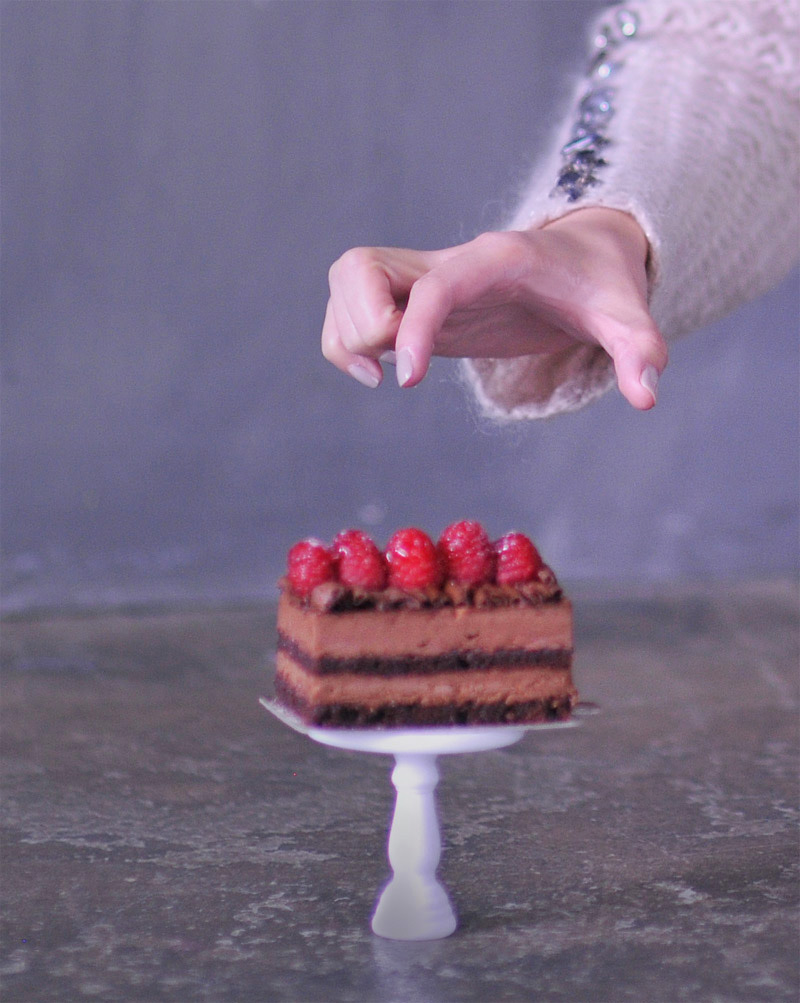 food blogger reaching for cake